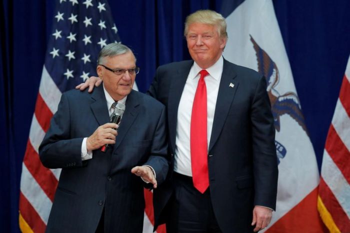 Donald Trump is joined onstage by Maricopa County Sheriff Joe Arpaio (L) at a campaign rally in Marshalltown, Iowa in January 26, 2016, after Arpaio endorsed his presidential bid.