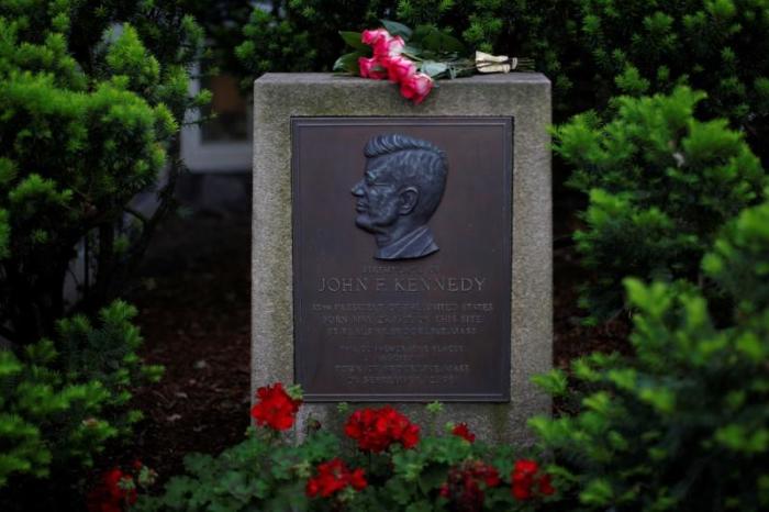 Roses lie on a marker outside the home where President John F. Kennedy was born 100 years ago on May 29, 1917, in Brookline, Massachusetts, U.S., May 29, 2017.