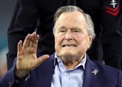 Former U.S. President George H.W. Bush arrives on the field to do the coin toss ahead of the start of Super Bowl LI between the New England Patriots and the Atlanta Falcons in Houston, Texas, U.S. on February 5, 2017.
