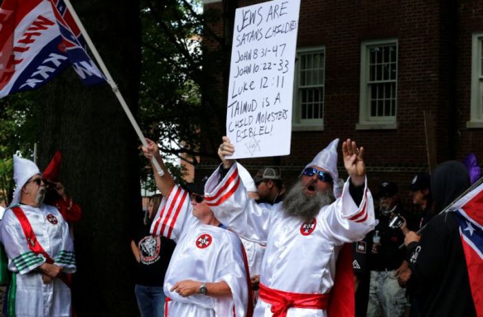 Members of the Ku Klux Klan rally in support of Confederate monuments in Charlottesville, Virginia, U.S. July 8, 2017.