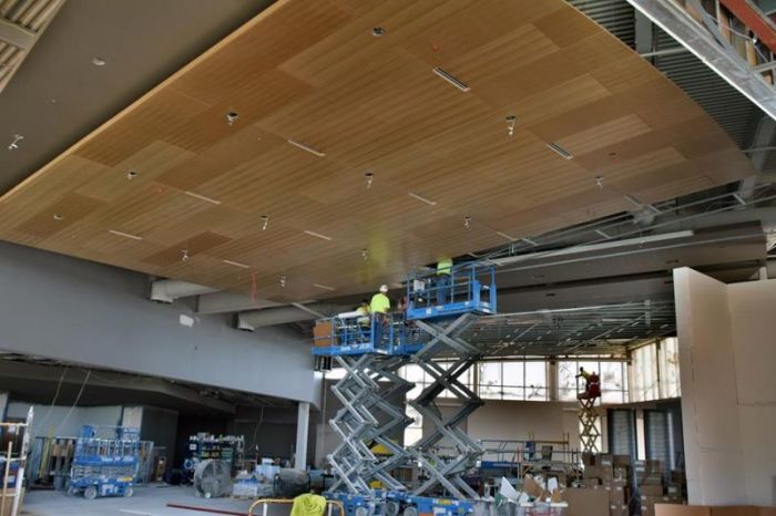 Eucalyptus paneling being installed on the ceiling of the Gathering Place at Calvary Church in Grand Rapids, Michigan, in June 2017. This area (located across from the Sanctuary) will be a place for community gatherings, large group Bible Studies, and events.