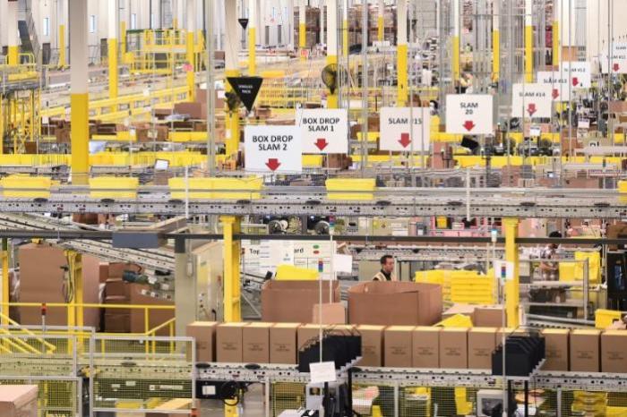 Workers process outgoing shipments at an Amazon Fulfillment Center on Cyber Monday in Tracy, California, U.S. November 28, 2016.
