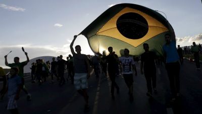 People marching with the Brazilian flag in this undated photo.