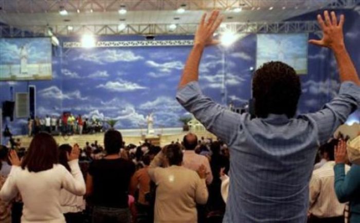 Evangelical Protestantism followers pray in the Renascer em Cristo church in Sao Paulo, Brazil, May 2, 2007.