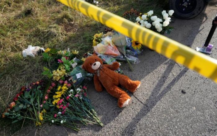 A Teddy bear lies under police tape at a makeshift memorial for those killed in the shooting at the First Baptist Church of Sutherland, Texas, U.S., November 6, 2017.