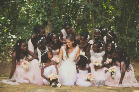 Missionary Katie Davis Majors, bestselling author of "Kisses from Katie" and "Daring to Hope," takes a photo with her 13 adopted Ugandan daughters ahead of her wedding.