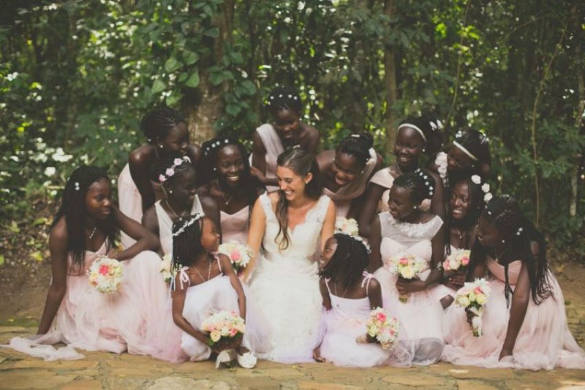 Missionary Katie Davis Majors, bestselling author of "Kisses from Katie" and "Daring to Hope," takes a photo with her 13 adopted Ugandan daughters ahead of her wedding.