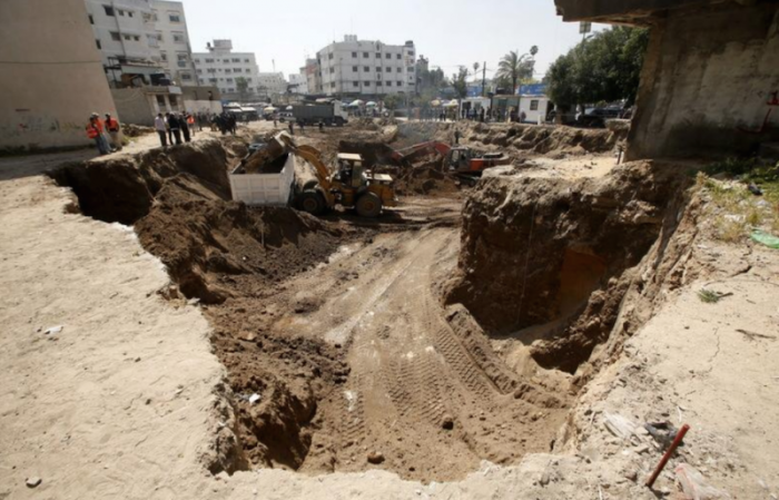 An excavator and a front loader operate at the site where ancient ruins, which archaeologists say may be part of a Byzantine church or cathedral dating from around 1,500 years ago, were found in Gaza City April 4, 2016.