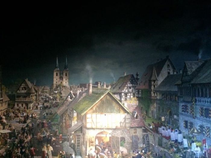 A portion of the W360 panorama by artist Yadegar Asisi in Wittenberg, Germany, shows the downtown area, with St, Mary's Church in the background.