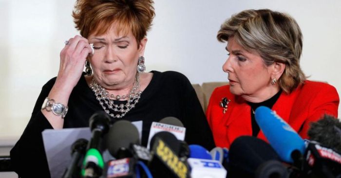 Beverly Nelson (L) reacts as she reads a statement to reporters with attorney Gloria Allred during a news conference announcing new allegations of sexual misconduct against Alabama Republican congressional candidate Roy Moore, in New York, November 13, 2017.
