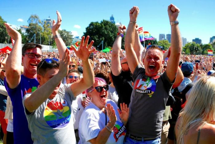 Supporters of the 'Yes' vote for marriage equality celebrate after it was announced the majority of Australians support same-sex marriage in a national survey, at a rally in Sydney on November 14, 2017.
