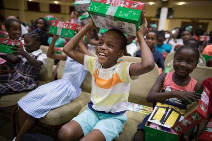 Children displaced from their homes in Barbuda receive Operation Christmas Child shoeboxes during an early distribution on the island of Antigua on Nov. 7, 2017.