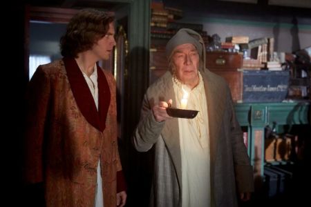 (L-R) Dan Stevens and Christopher Plummer star as Charles Dickens and Ebenezer Scrooge in "The Man Who Invented Christmas," in theaters on November 22, 2017.