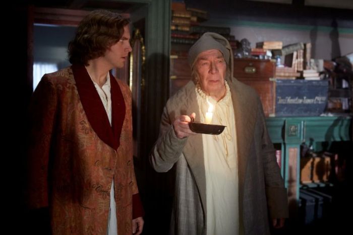 (L-R) Dan Stevens and Christopher Plummer star as Charles Dickens and Ebenezer Scrooge in 'The Man Who Invented Christmas,' in theaters on November 22, 2017.
