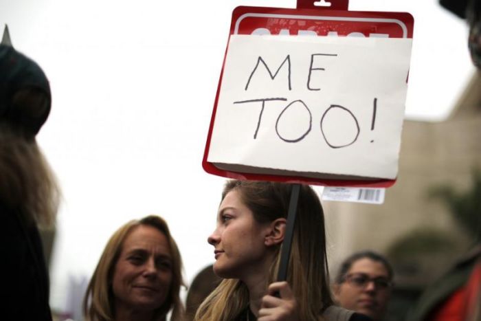 People participate in a protest march for survivors of sexual assault and their supporters in Hollywood, Los Angeles, California, U.S. November 12, 2017.