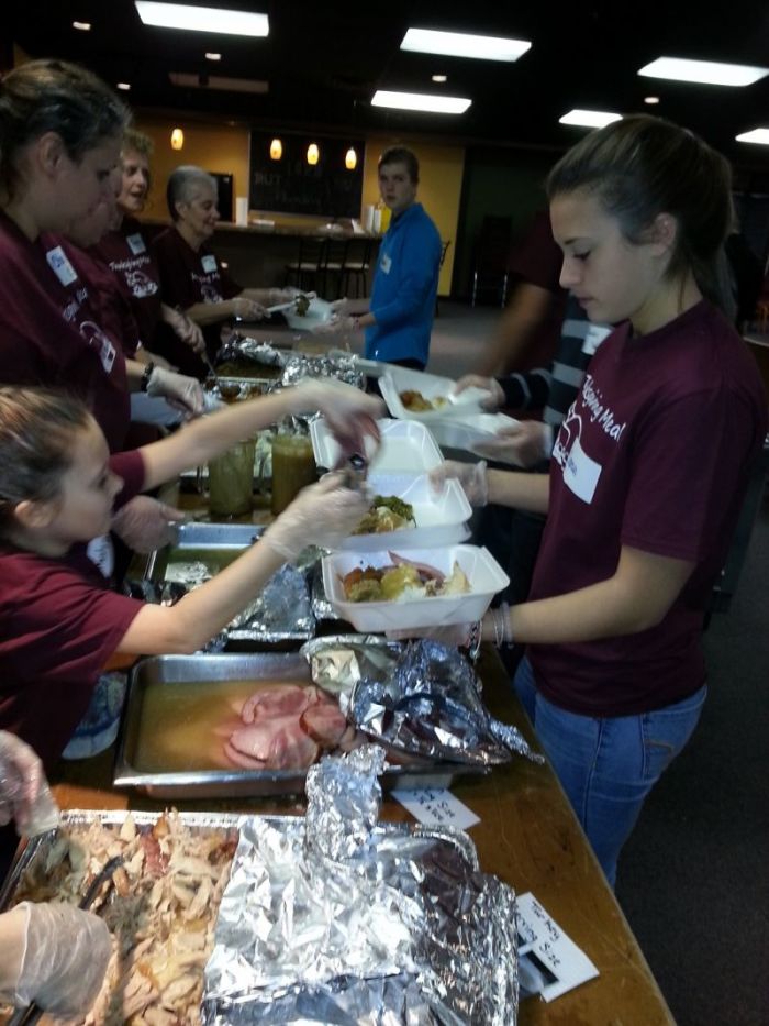 Volunteers at StoneBridge Church in Findlay, Ohio help prepare meals for the annual free community Thanksgiving meal.