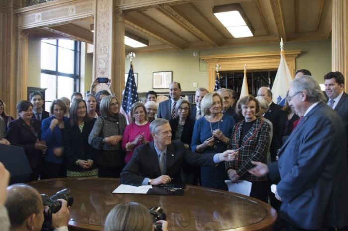 Massachusetts Republican Gov. Charlie Baker participates in a signing ceremony of a bill that mandates state insurers to provide contraception coverage on Nov. 20, 2017 at the Massachusetts State House in Boston.