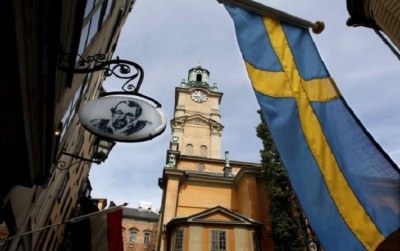 Sweden's flag is seen near the Stockholm Cathedral in Gamla Stan or the Old Town district of Stockholm, Sweden, June 9, 2010.