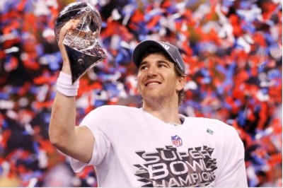 New York Giants quarterback Eli Manning holds the Vince Lombardi Trophy after the Giants defeated the New England Patriots in Super Bowl XLVI, Feb. 5, 2012.