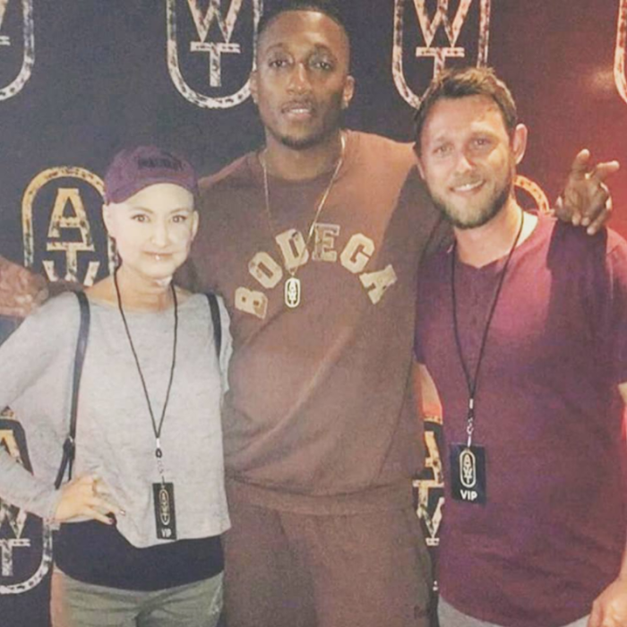 Lecrae poses with fans Hayden and Adam Palm after a concert, November 2017.
