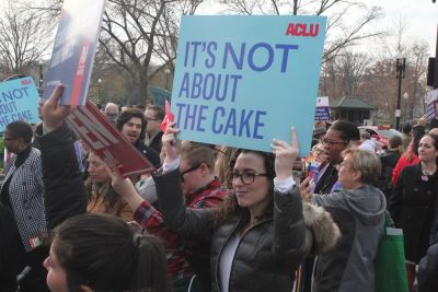 A supporter of same-sex couple David Mullins and Charlie Craig, holds a sign in front of U.S. Supreme Court as arguments in the case of Masterpiece Cakeshop v. Colorado Civil Rights Commission are heard inside on December 5, 2017.