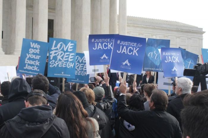 Supporters of Colorado baker Jack Phillips hold signs in front of the United States Supreme Court as arguments in Masterpiece Cakeshop v. Colorado Civil Rights Commission are heard on December 5, 2017.