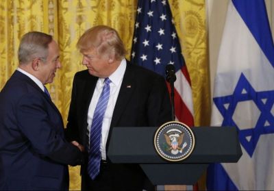 President Donald Trump (R) greets Israeli Prime Minister Benjamin Netanyahu at a joint news conference at the White House on February 15, 2017.