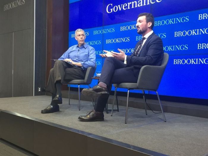 Saria Samakie (R) speaks about his youth in Syria during event at the Brookings Institution in Washington, D.C. Former United States Sec. of Education Arne Duncan (L) interviewed Samakie during the segment.