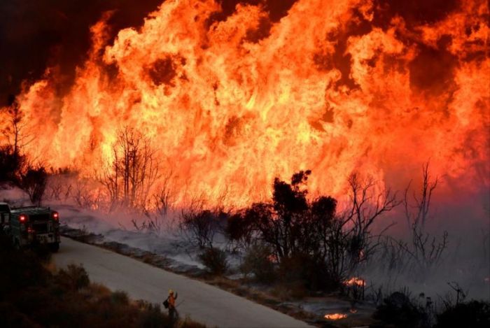 Firefighters attack the Thomas Fire's north flank with backfires as they continue to fight a massive wildfire north of Los Angeles, near Ojai , California, U.S., December 9, 2017.