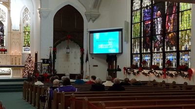 People gather for the Blue Christmas service organized by Living in Faith Together Parish of Fremont, Ohio.