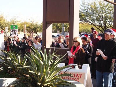 Over 120 pro-life activists sing Christmas carols at the 'Peace in the Womb' caroling day event at a Planned Parenthood clinic in Tempe, Arizona, December 2016.