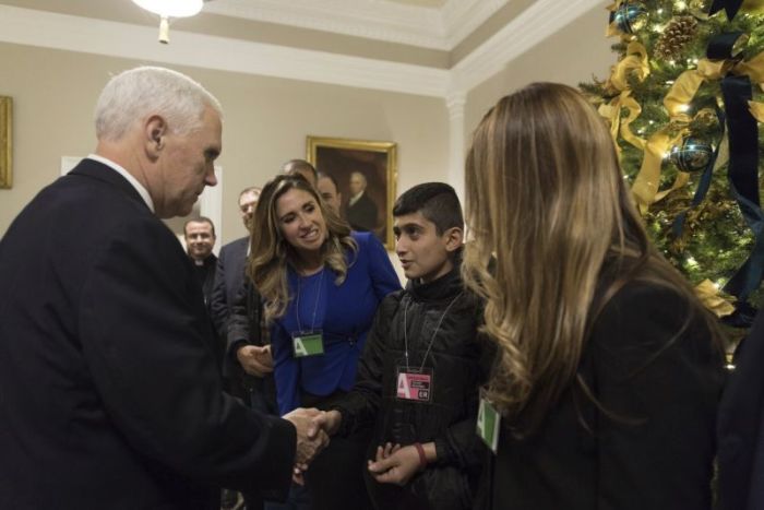 Iraqi Christian boy Noeh, 12, shakes Vice President Donald Trump's hand at the White House on Dec. 13, 2017.