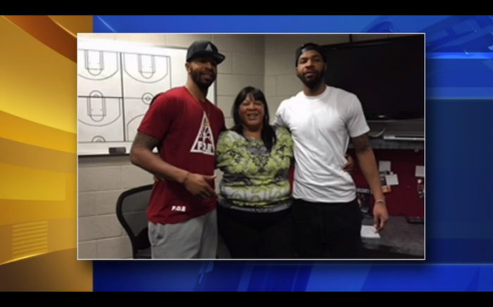 Twin NBA stars pose with mother Thomasine as the boys pay off customers' layaway orders at Philly Walmart, Dec 2017.