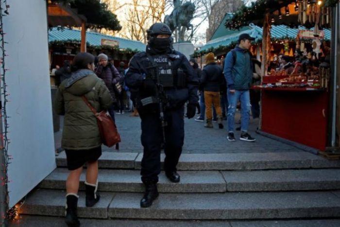 A member of the New York Police Department's Counterterrorism Bureau patrols the Union Square holiday market following the Berlin Christmas market attacks in Manhattan, New York City, December 20, 2017.