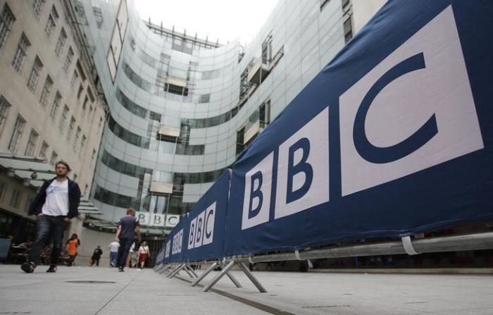 BBC workers place barriers near to the main entrance of the BBC headquarters and studios in Portland Place, London, Britain, July 16, 2015.