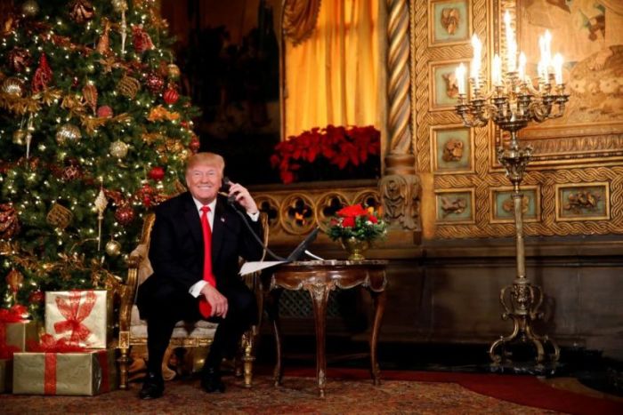 U.S. President Donald Trump participates in NORAD (North American Aerospace Defense Command) Santa Tracker phone calls with children at Mar-a-Lago estate in Palm Beach, Florida, U.S., December 24, 2017.