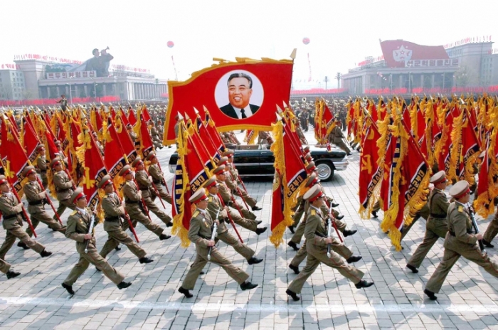 North Korea's military personnel parade with a portrait of North Korea's late leader Kim Il-sung in central Pyongyang April 25, 2007.