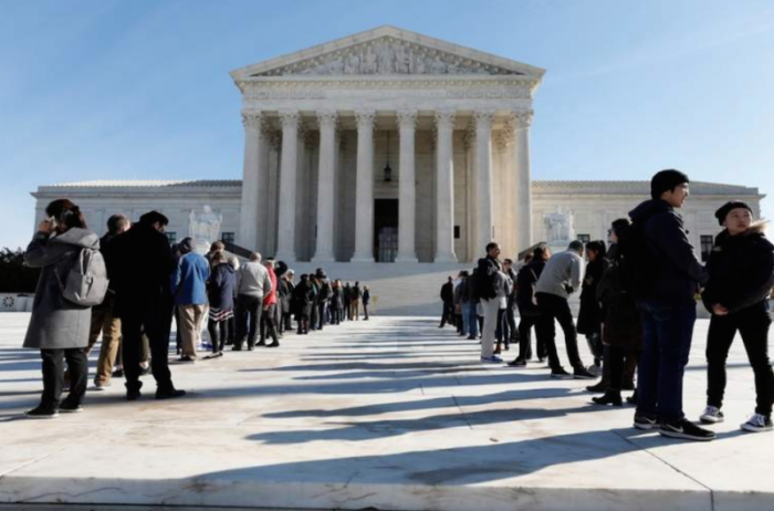 Visitors stand in line outside the Supreme Court in Washington, U.S., November 27, 2017.