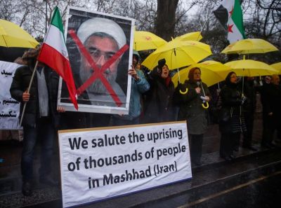 Opponents of Iranian President Hassan Rouhani hold a protest outside the Iranian embassy in west London, December 31, 2017.