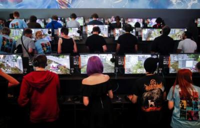 Gamers playing video games in a photograph taken on August 23, 2017.