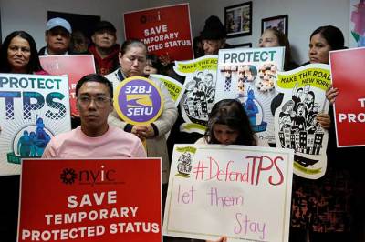 People gather during a news conference at the New York Immigration Coalition following U.S. President Donald Trump's announcement to end the Temporary Protection Status for Salvadoran immigrants in Manhattan, New York City, U.S., January 8, 2018.