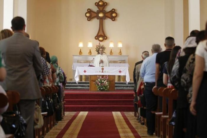Iraqi Christians attend an Easter mass at the St. Joseph Chaldean Church in Baghdad, March 31, 2013.