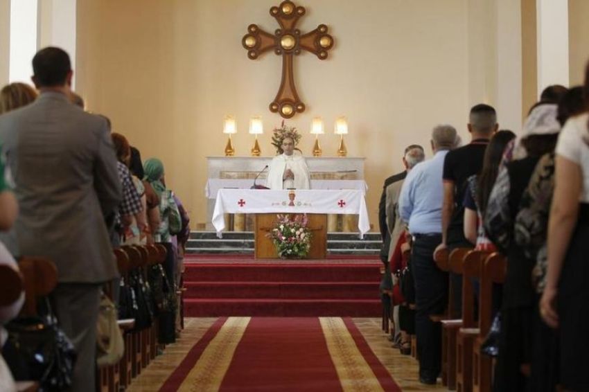 Iraqi Christians attend an Easter mass at the St. Joseph Chaldean Church in Baghdad, March 31, 2013.