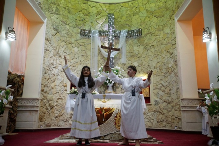 Iraqi Christians attend an Easter celebration at St George Chaldean Church in Baghdad, Iraq, April 15, 2017.
