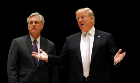 U.S. President Donald Trump speaks as he and House Majority Leader Kevin McCarthy arrive for dinner at Trump's golf club in West Palm Beach, Florida, U.S., January 14, 2018.