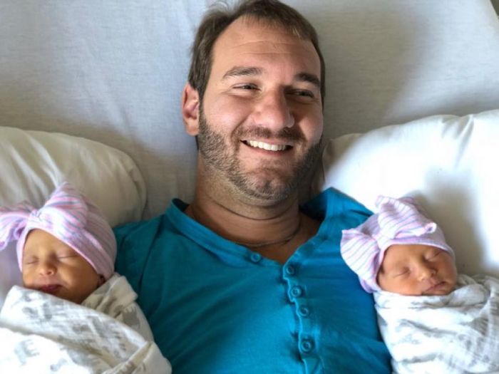 Evangelist Nick Vujicic with his twin daughters in a photo posted on December 25, 2017.