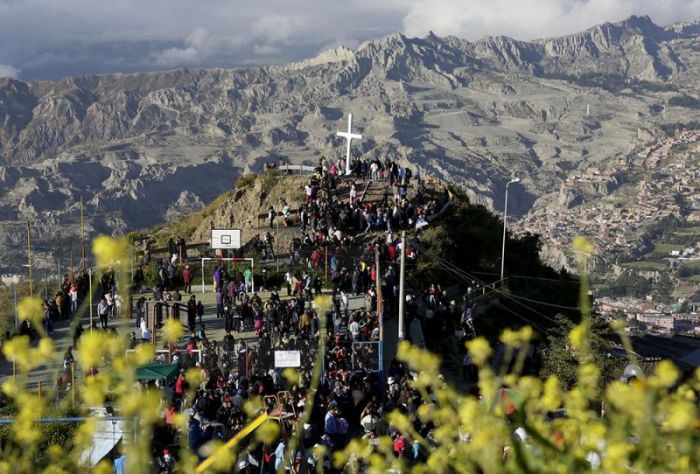Penitents attend a reenactment of the crucifixion of Jesus Christ on Good Friday in the outskirts of La Paz, Bolivia, on April 3, 2015.