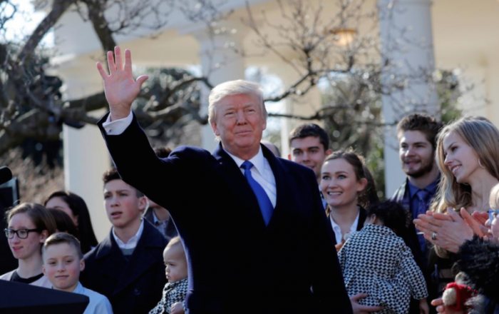U.S. President Donald Trump waves after addressing the annual March for Life rally, taking place on the National Mall, from the White House Rose Garden in Washington, U.S., January 19, 2018.