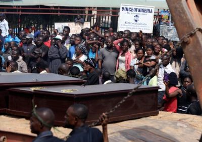 People react as a truck carries the coffins of people killed by the Fulani herdsmen, in Makurdi, Nigeria January 11, 2018.
