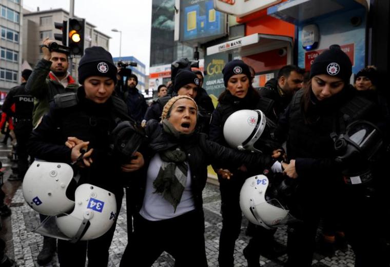 Riot police detain a demonstrator during a protest against Turkey's military operation in Syria's Afrin region, in Istanbul, Turkey, January 23, 2018.